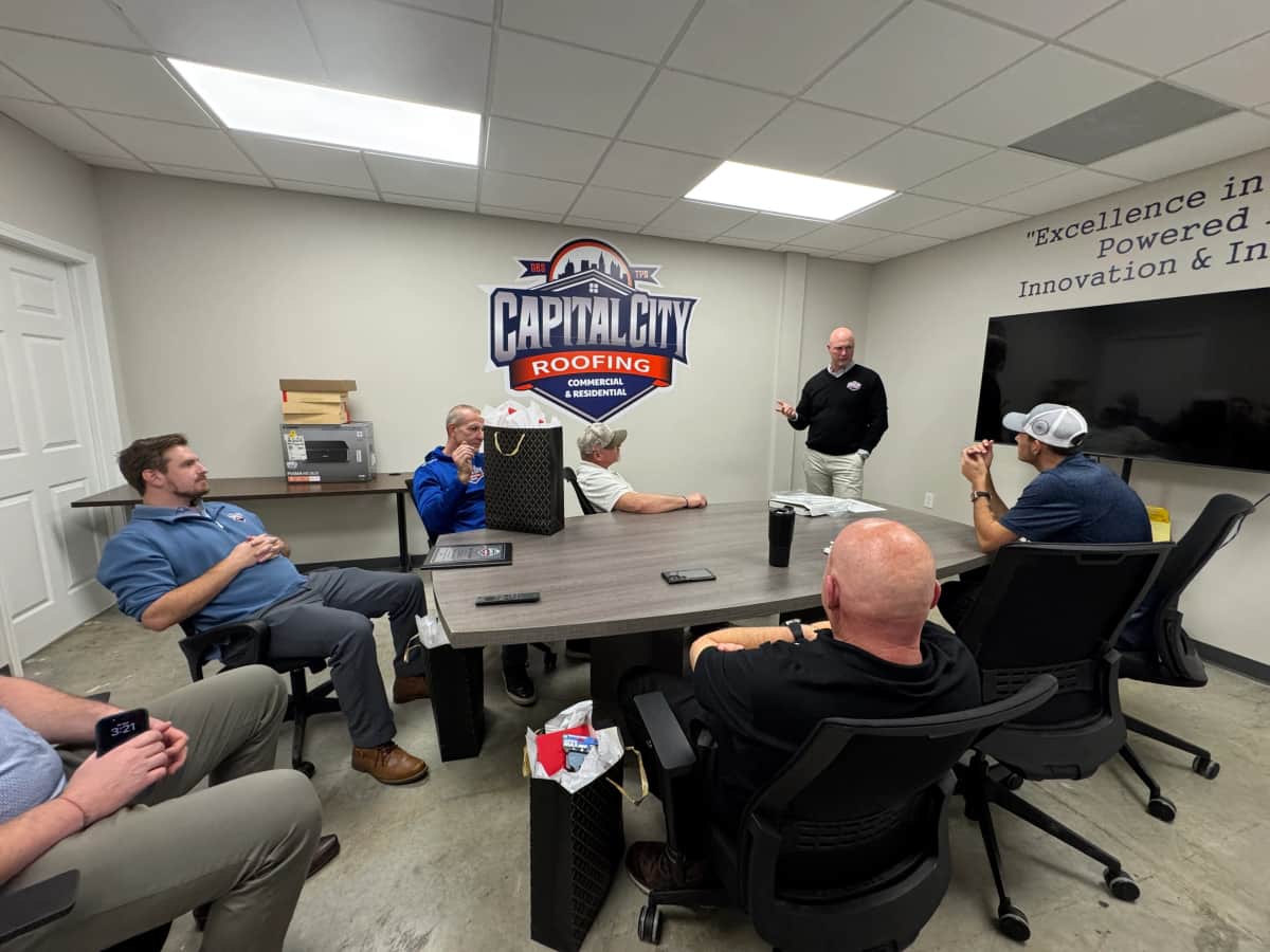 The Capital City Roofing team in a daily huddle